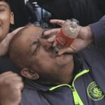 Man-City-fan-drinking-from-Arsenal-bottle.jpg